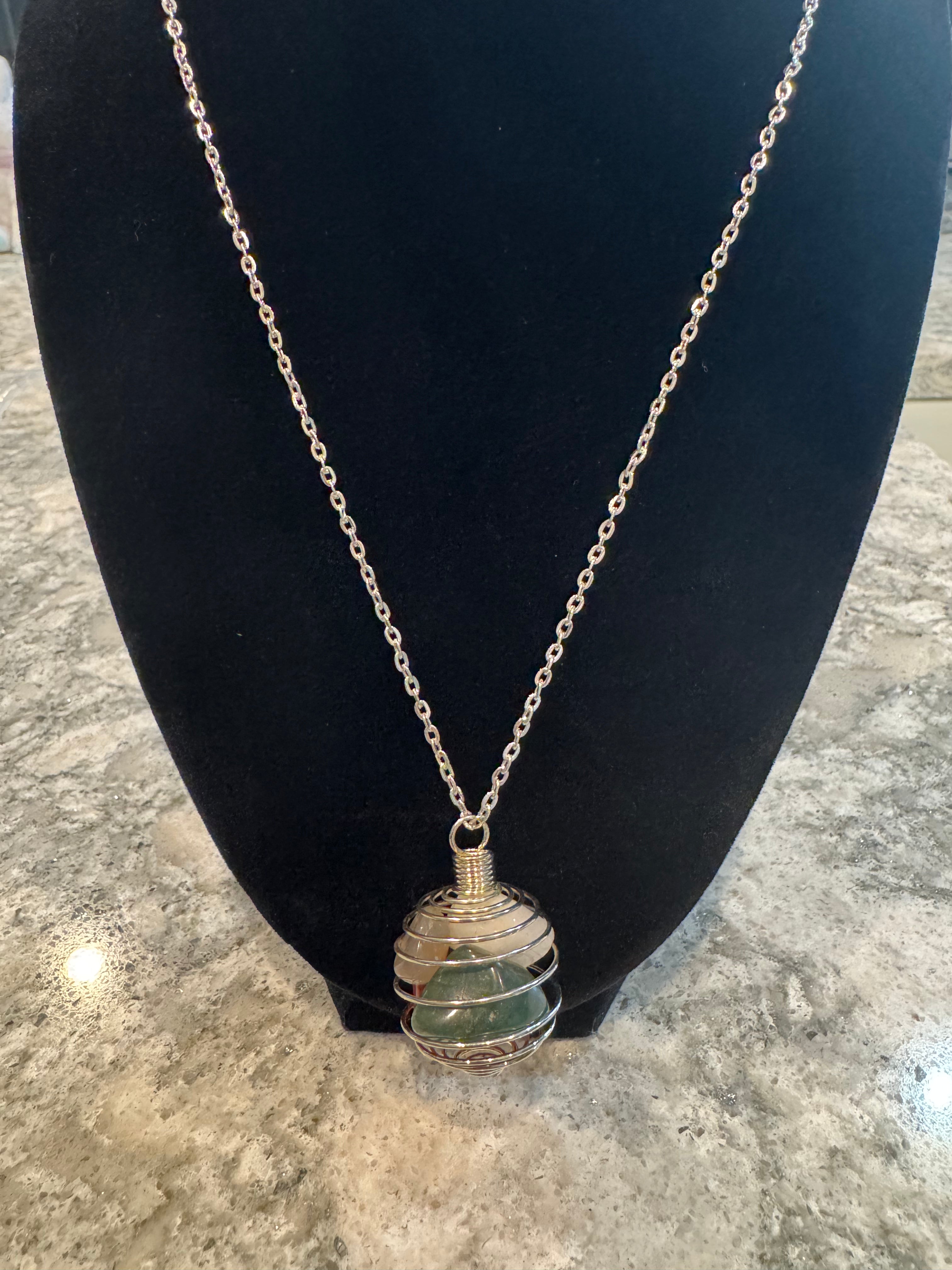 Silver Chain and Cage Holding white quartz, clear quartz, red jasper, and green jasper Gems Stones